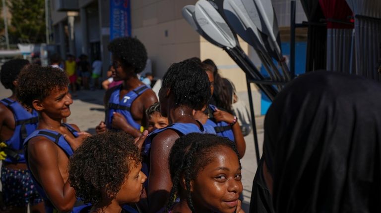 Children attend a swimming camp organized by the Grand Bleu...