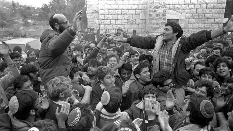 Right-wing Israeli Rabbi Moshe Levinger, left, and settler leader Hanan...