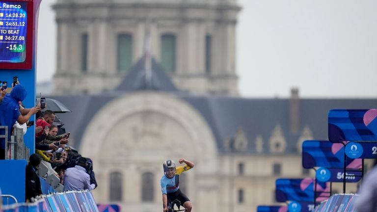 Remco Evenepoel, of Belgium, wins the men's cycling time trial...