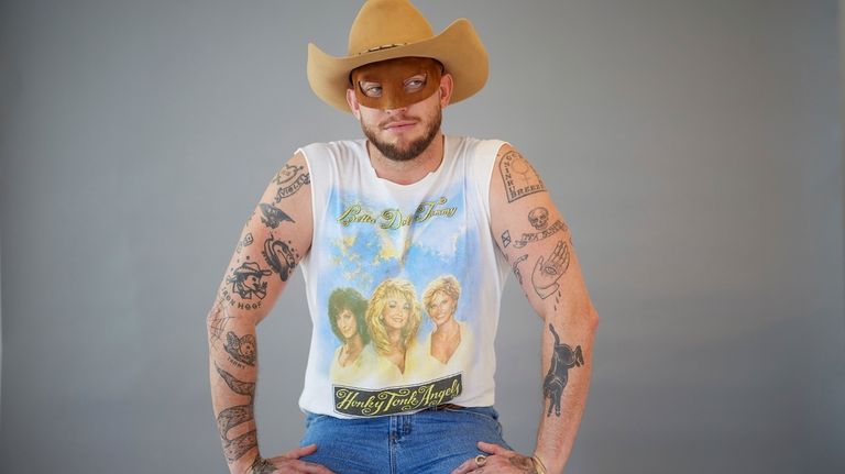 Country music artist Orville Peck poses for portraits on Wednesday,...