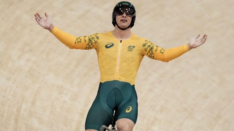 Matthew Richardson of Australia celebrates winning a men's sprint semifinals,...