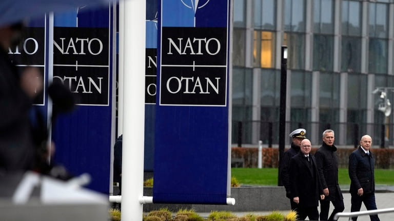 NATO Secretary General Jens Stoltenberg, second right, arrives for a...