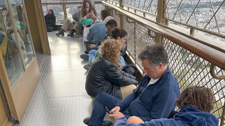 Visitors stranded at the top of the Eiffel Tower while...