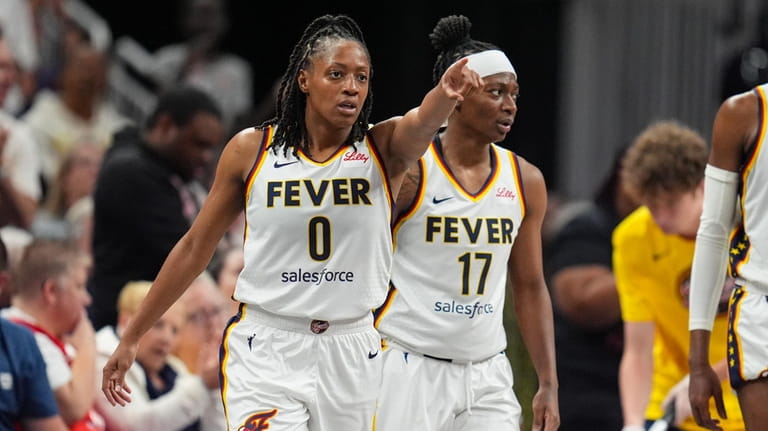 Indiana Fever guard Kelsey Mitchell (0) gestures after hitting a...