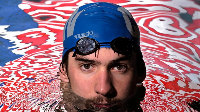 Olympic gold medalist Michael Phelps poses in the Belmont Plaza...