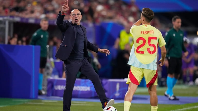 Spain's head coach Luis de la Fuente gestures during a...