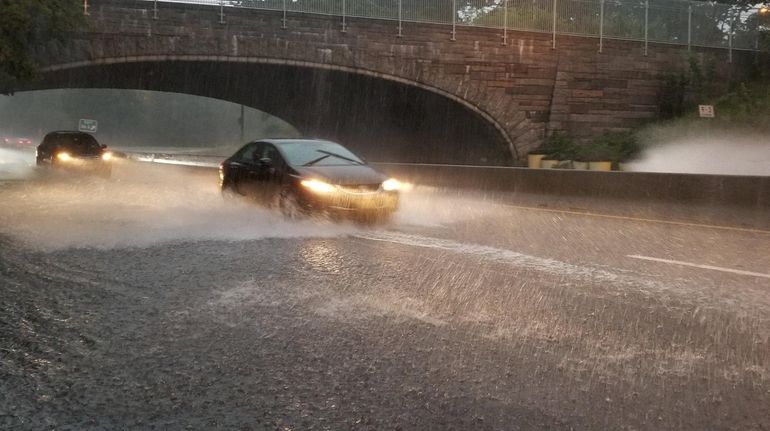 The eastbound Northern State Parkway begins to flood near Exit...