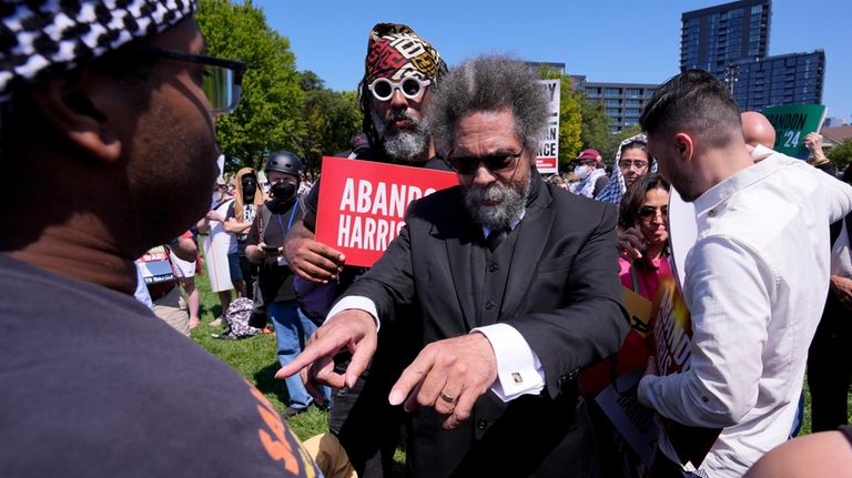 Progressive activist Cornel West gestures during a demonstration prior to...