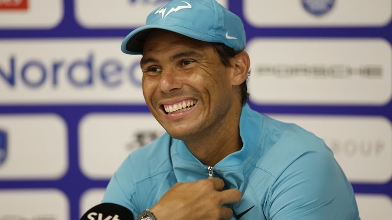 Rafael Nadal of Spain speaks during a press conference after...