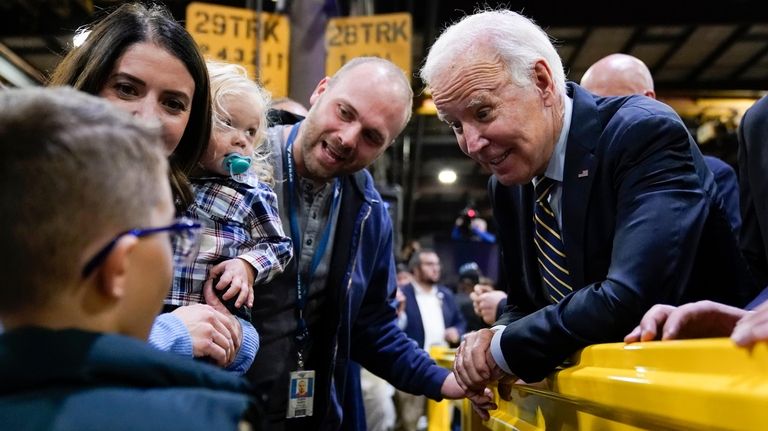 President Joe Biden greets audience members after speaking at the...