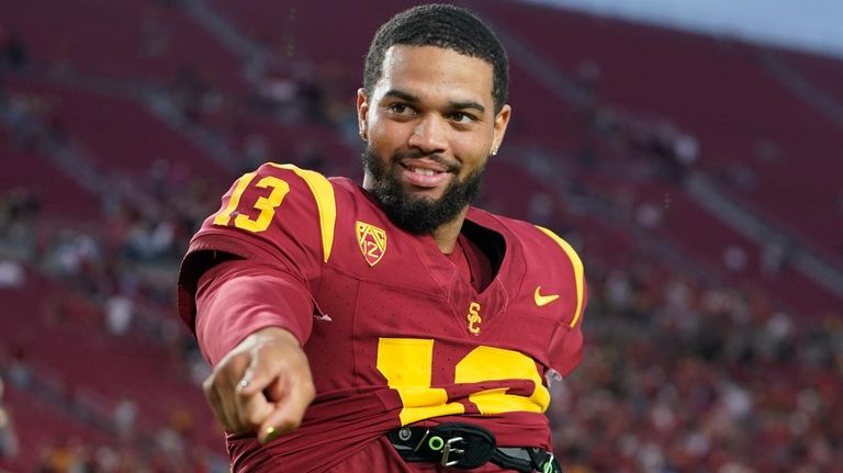 Southern California quarterback Caleb Williams gestures after winning an NCAA...