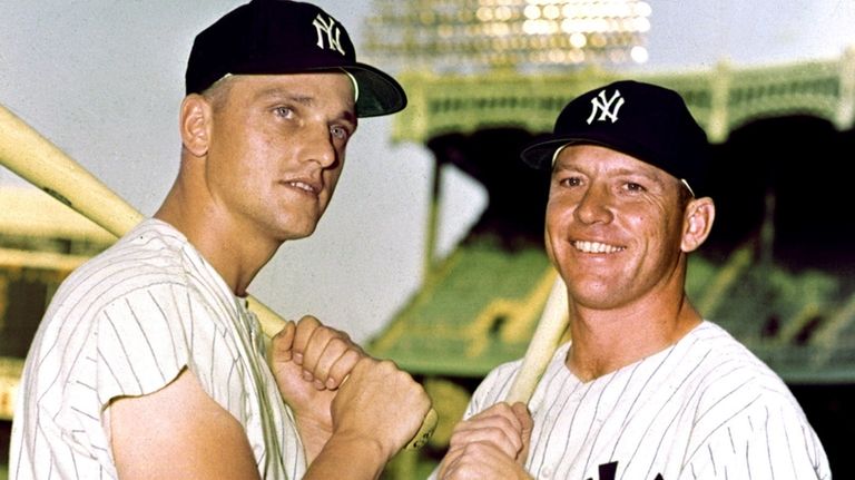 Mickey Mantle, right, and Roger Maris pose in their Yankees...