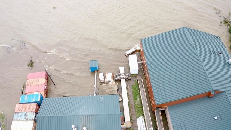 Water from an overflowing Kuskokwim River floods Napakiak, Alaska, Sunday,...