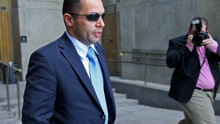 NYPD officer Kenneth Moreno leaves Manhattan Criminal Court. (April 15,...