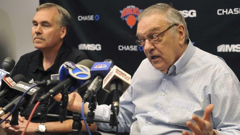 Knicks president of basketball operations Donnie Walsh, right, answers questions...