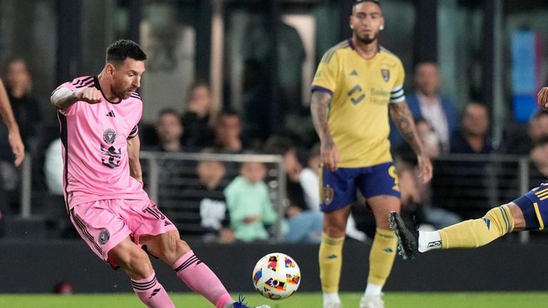 Inter Miami forward Lionel Messi, left, kicks the ball during...