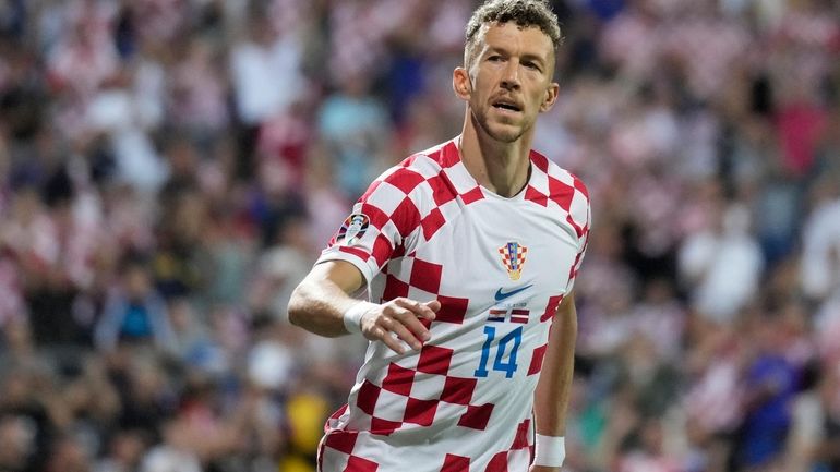 Croatia's Ivan Perisic celebrates after Croatia's Bruno Petkovic scored his...