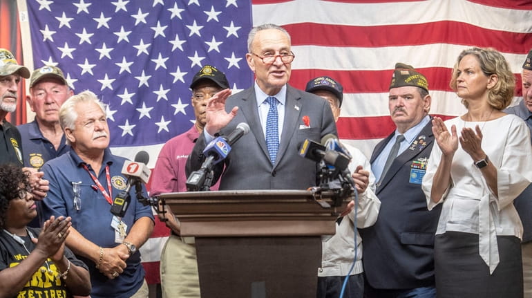 Sen. Chuck Schumer is joined by local officials and veterans Monday at the...