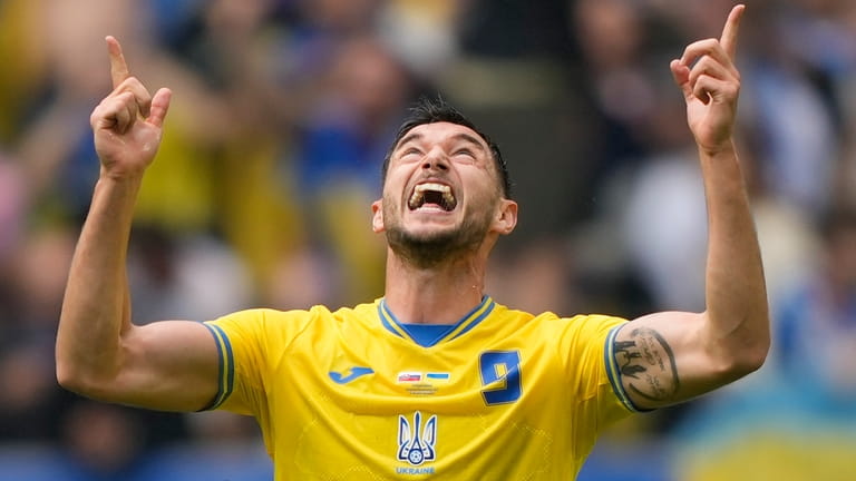 Ukraine's Roman Yaremchuk celebrates after scoring his side's second goal...