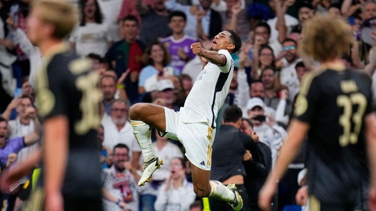 Real Madrid's Jude Bellingham celebrates after scoring his side's first...