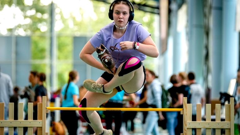 A girl clears the bar during the first German Hobby...