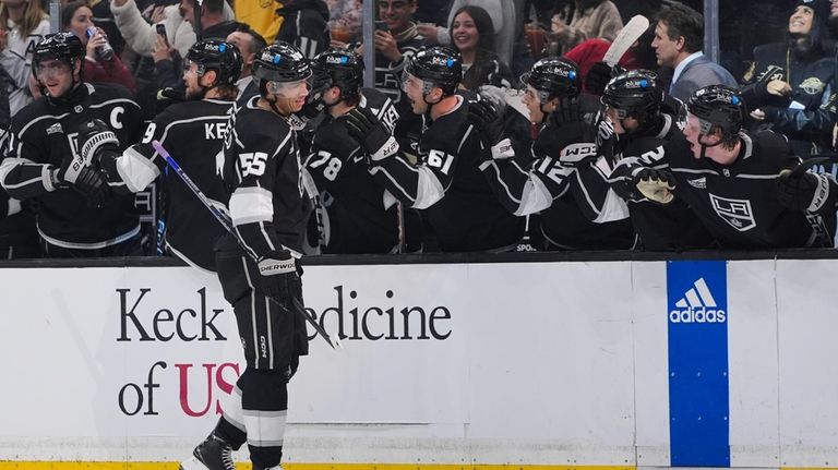 Los Angeles Kings right wing Quinton Byfield is congratulated for...