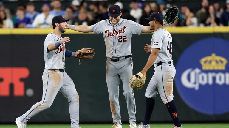 Detroit Tigers left fielder Matt Vierling, left, center fielder Parker...