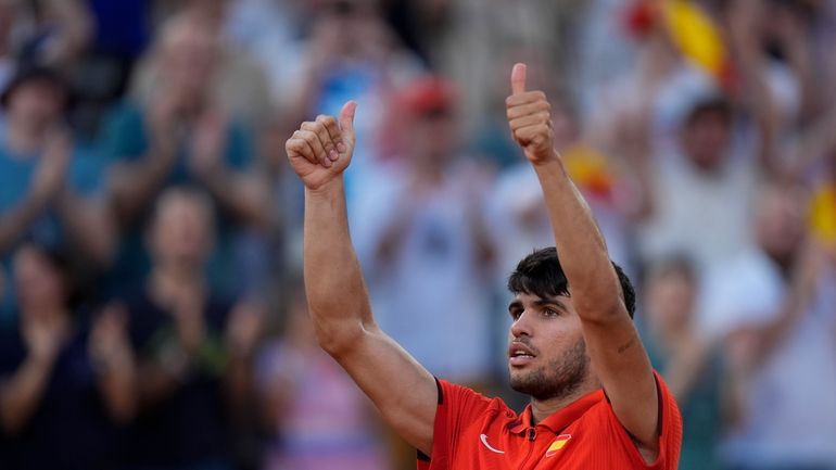 Carlos Alcaraz of Spain celebrates after defeating Tallon Griekspoor of...