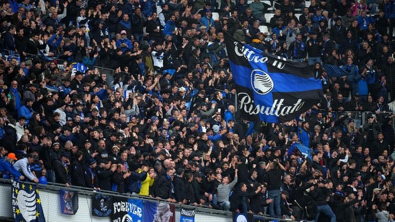 Fans cheer prior the start of the Europa League semifinal...