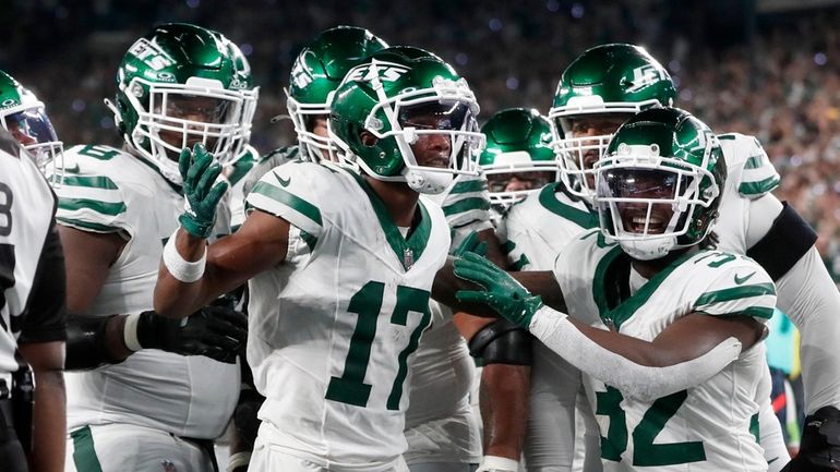 Garrett Wilson #17 of the New York Jets celebrates his...