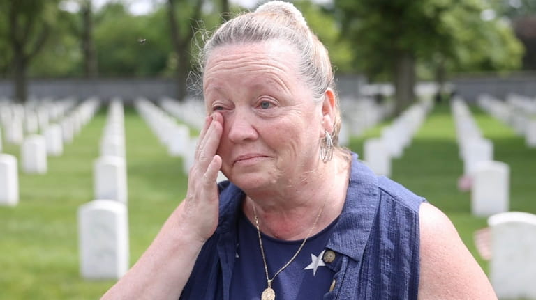 Susan Oehler, 62, of North Babylon, visits the grave site of...