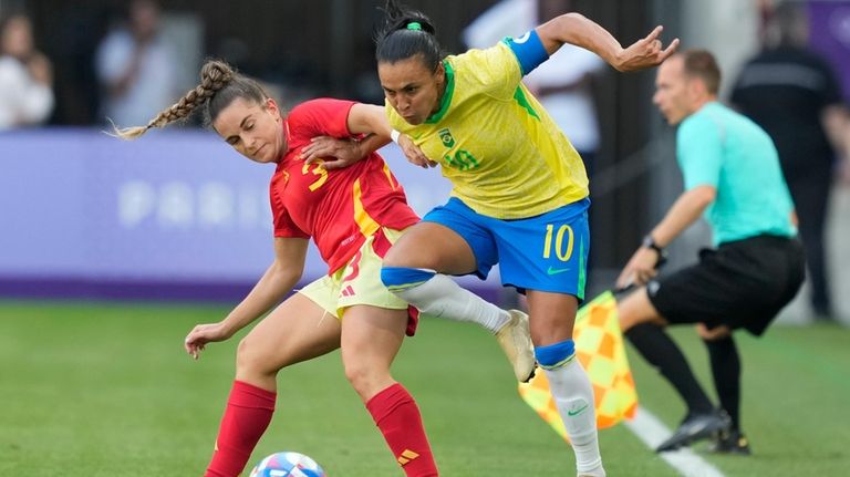 Brazil's Marta, right, and Spain's Teresa Abelleira battle for the...