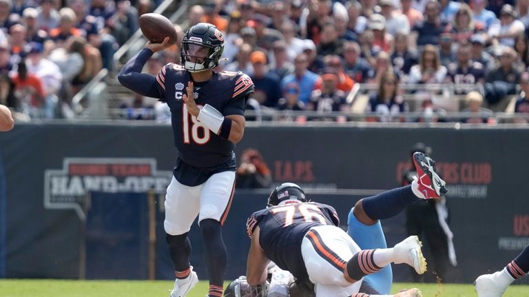 Chicago Bears quarterback Caleb Williams passes during the first half...