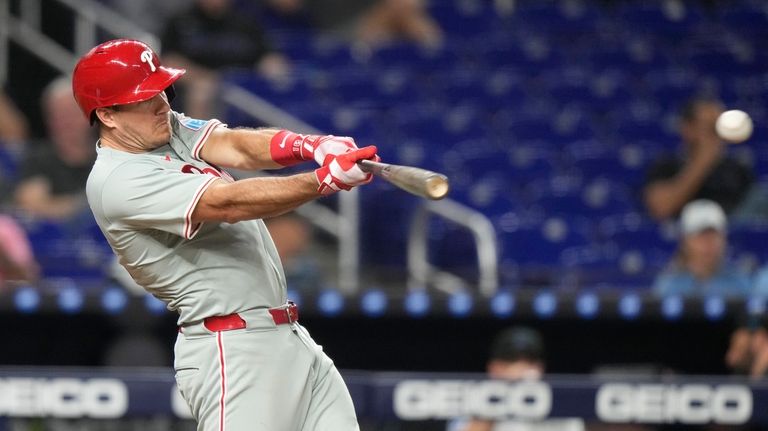 Philadelphia Phillies' J.T. Realmuto hits a single during the fourth...