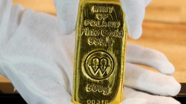A 500-gram bar of gold is seen in Warsaw, Poland,...