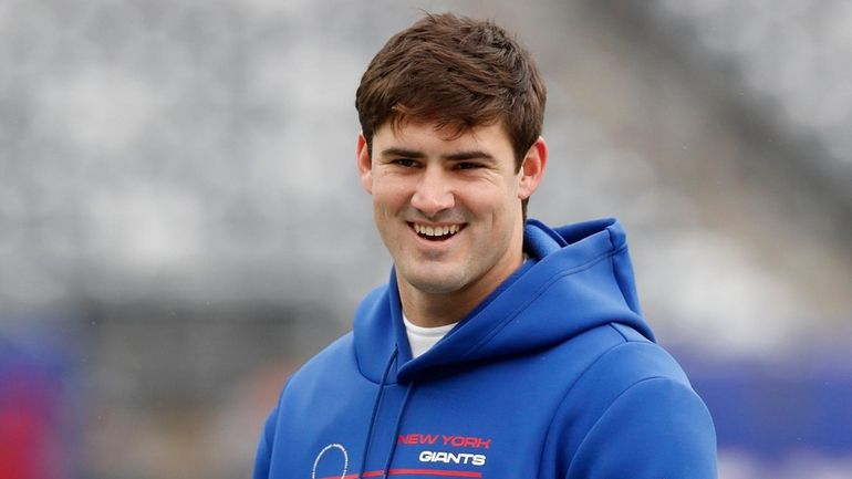 Giants quarterback Daniel Jones looks on before a game against...