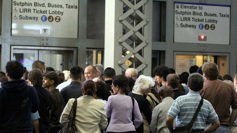 LIRR passengers wait for elevators to subway lines after a...