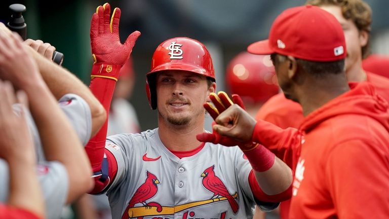 St. Louis Cardinals' Nolan Gorman celebrates in the dugout after...