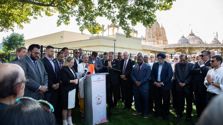 Community leaders gather to call for peace at the BAPS...