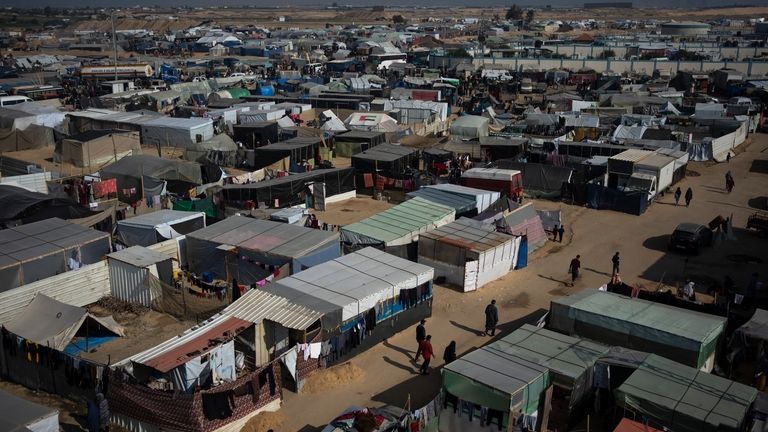 A view of the makeshift tent camp where Palestinians displaced...