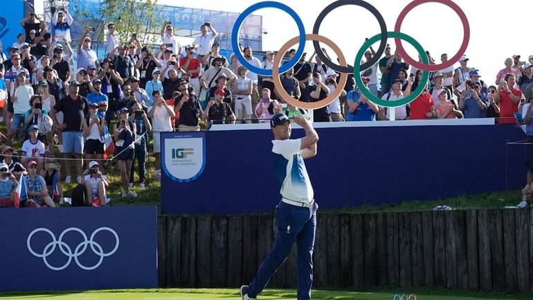 Victor Perez, of France, plays his tee shot off the...