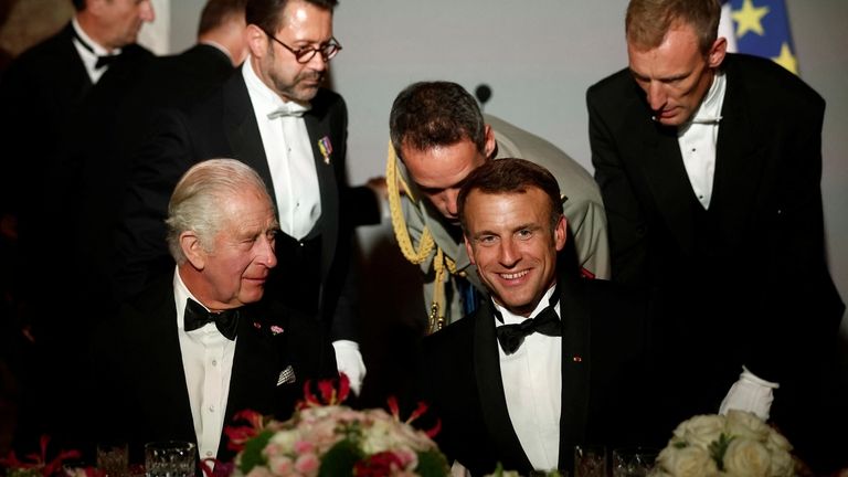 French President Emmanuel Macron, right, and Britain's King Charles III...