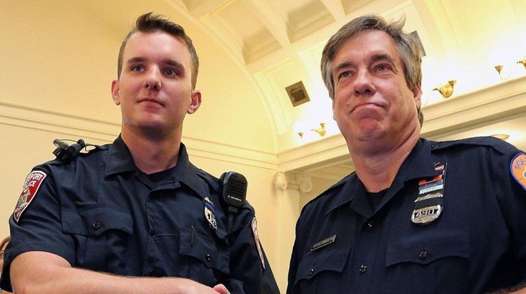 Freeport Police Officer Corey Cooke, left, and Nassau Police Officer...