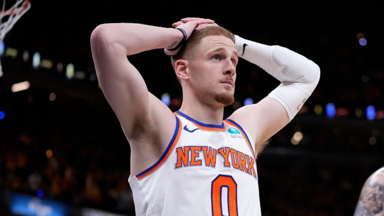 Knicks guard Donte DiVincenzo reacts at the end of Game...