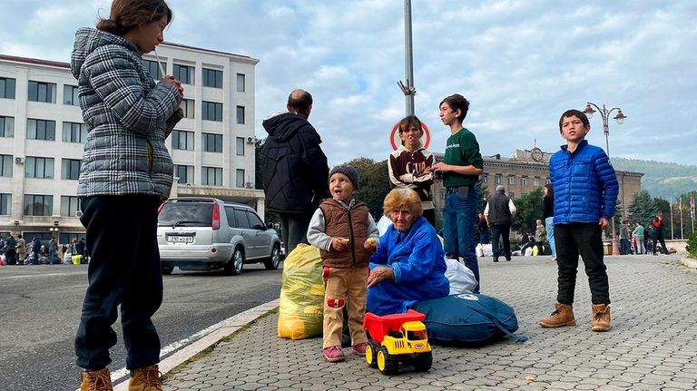 Ethnic Armenians gather in hope to leave Nagorno-Karabakh region for...