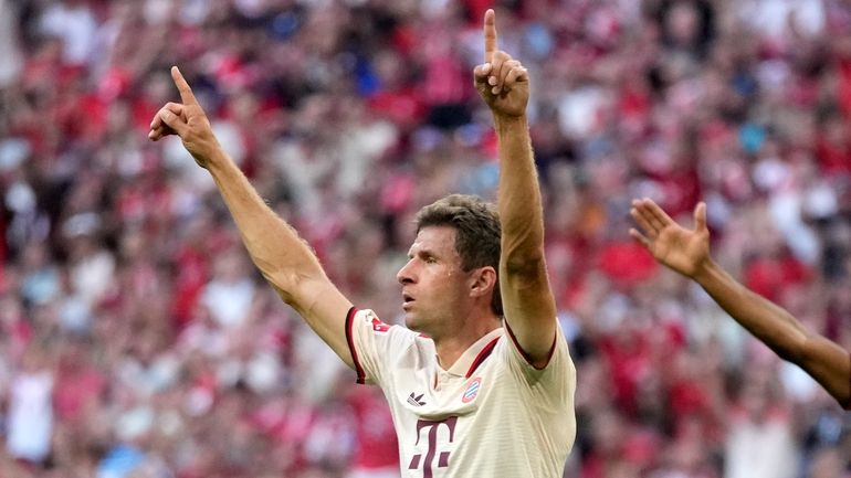 Bayern's Thomas Mueller celebrates after scoring his side's second goal...