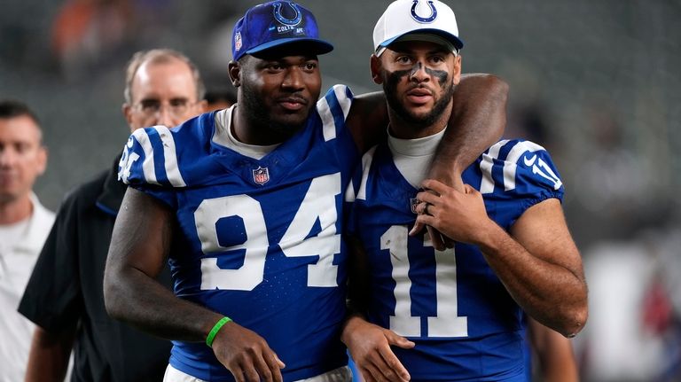 Indianapolis Colts defensive end Tyquan Lewis (94) walks off the...