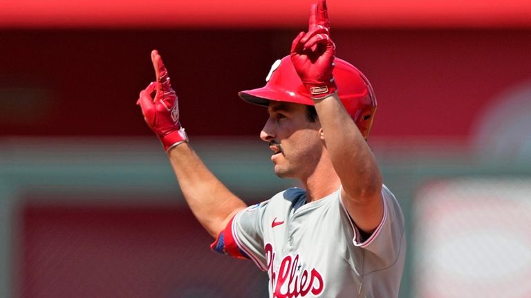 Philadelphia Phillies' Garrett Stubbs celebrates on second after hitting an...