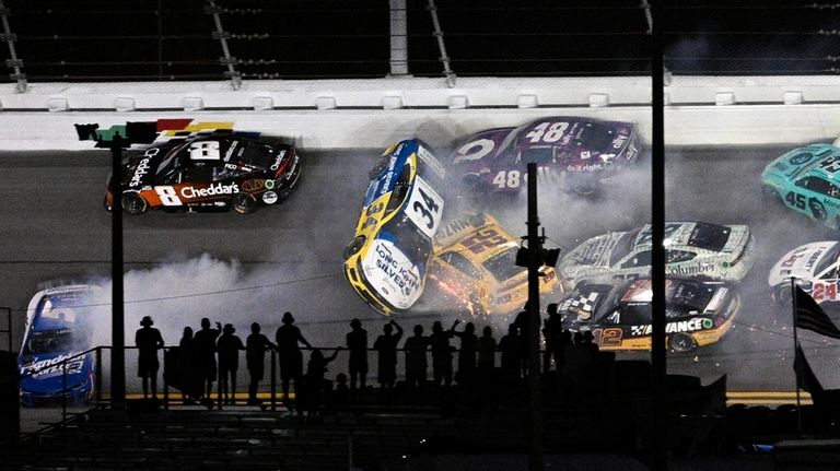 Michael McDowell (34) gets airborne in a collision with Joey...