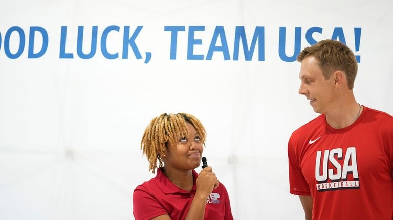 Team USA basketball athlete, Canyon Barry, talks with people before...